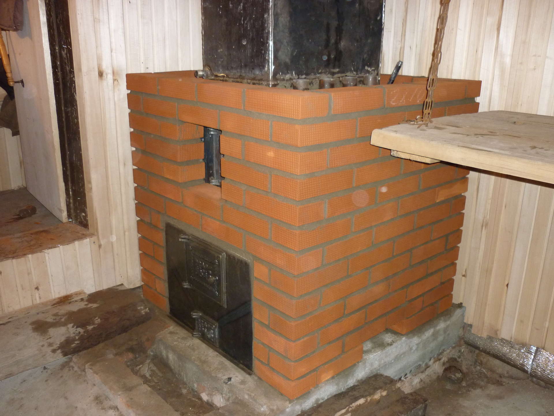 A stove for a garage on the wood: a wood burning stove with a long .